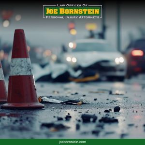 A traffic cone blocks signals scattered debris after an accident in Biddeford, ME 