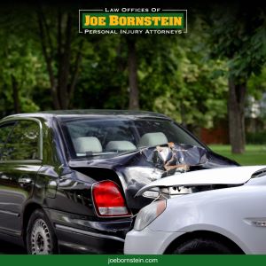 A white car hits the back of a black car in a Biddeford rear-end accident