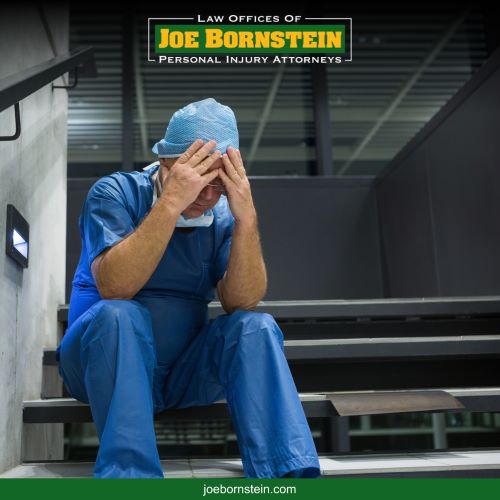 A doctor holds his head and covers his face after making a critical error with a patient's treatment in Maine