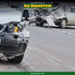 Two cars with severe front-end damage in the aftermath of a Portland car crash