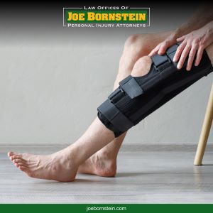 A Sanford accident victim tightens a brace around his leg injury